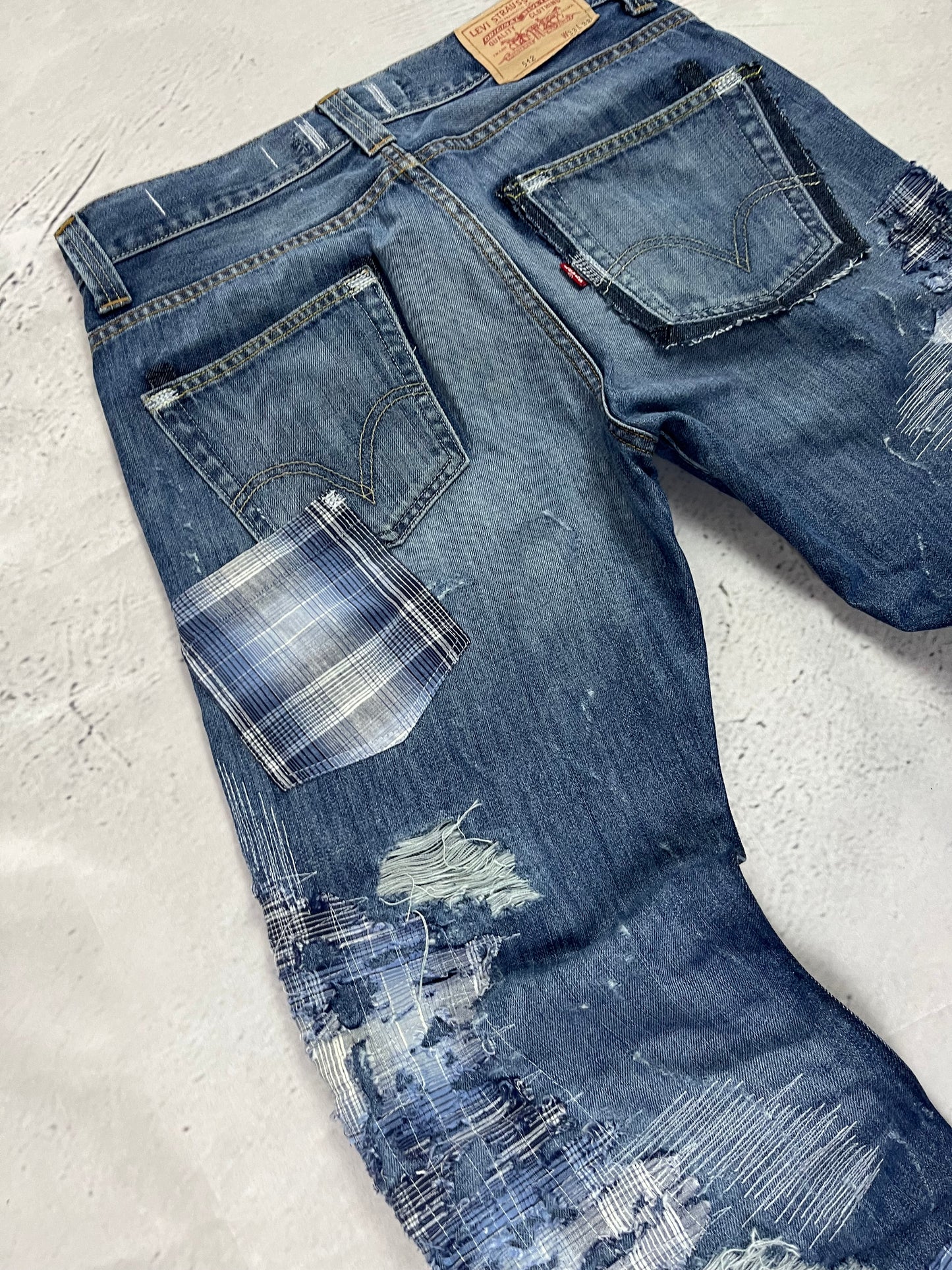 RIPPED PLAID PATCH DENIM
