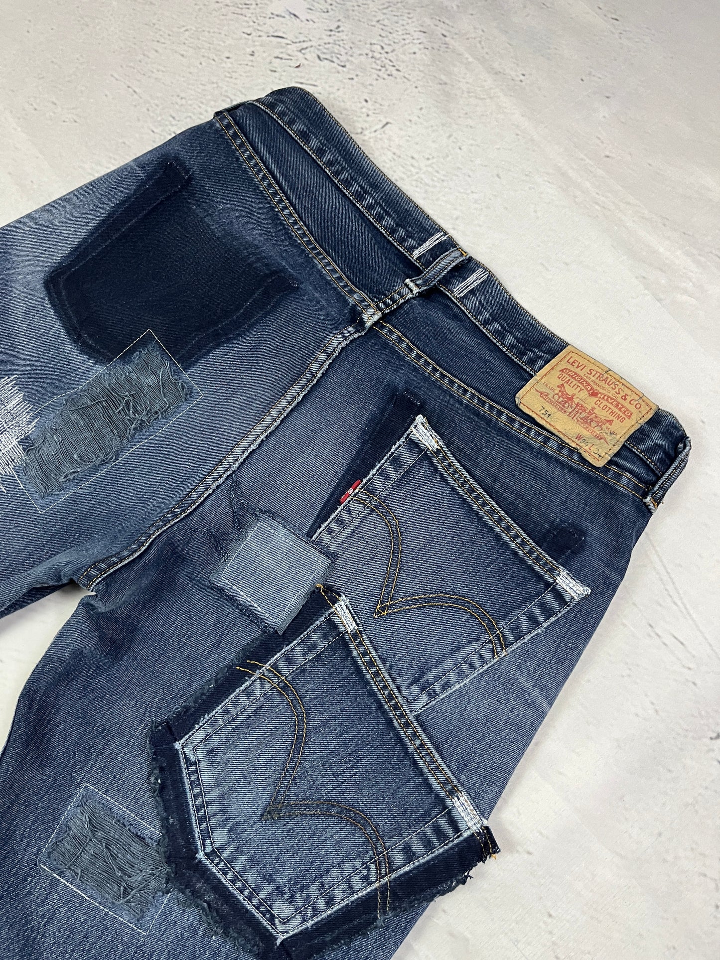 RAW STITCH DENIM SHORTS