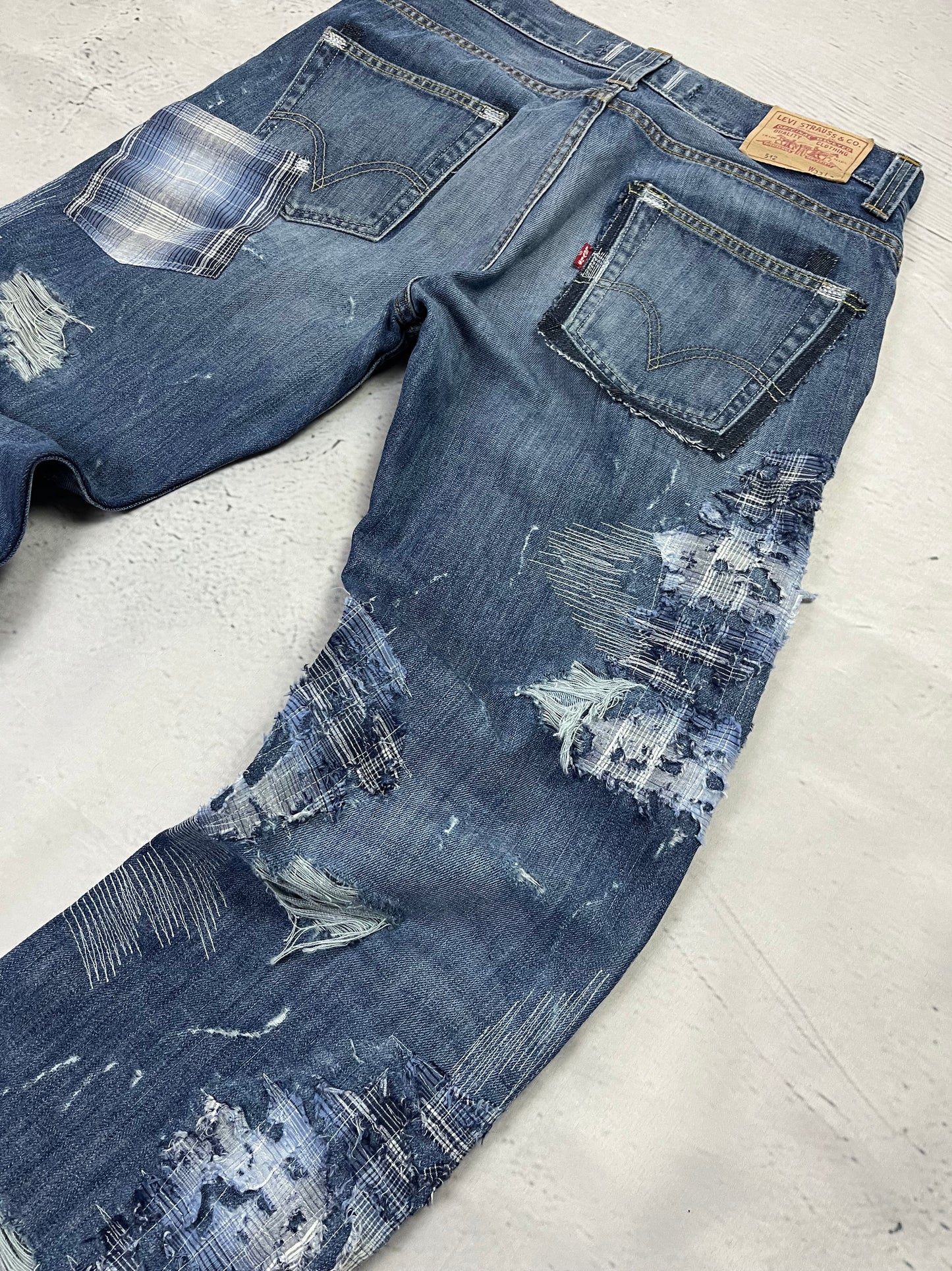 RIPPED PLAID PATCH DENIM