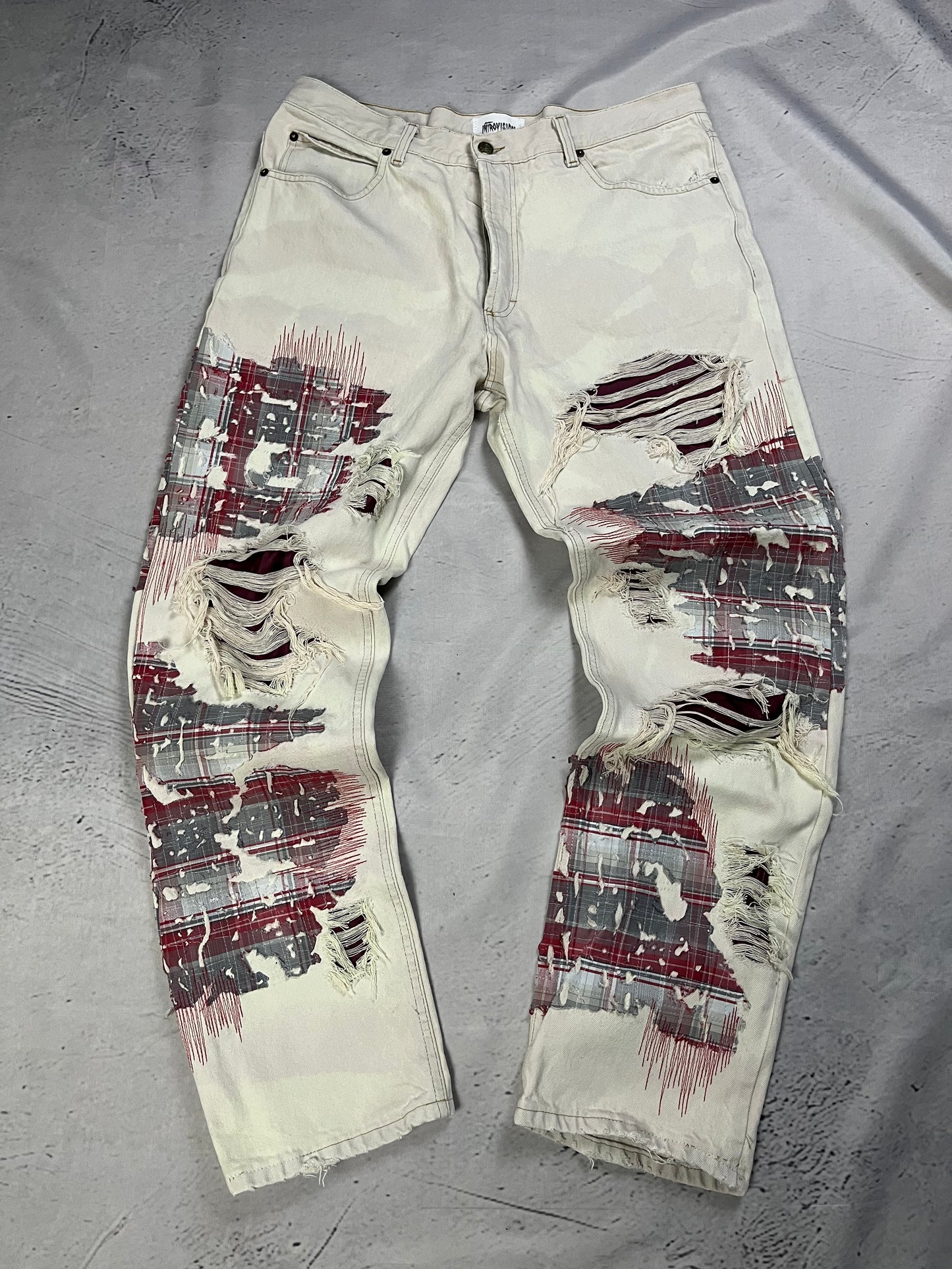 DISTRESSED PLAID PATCH DENIM