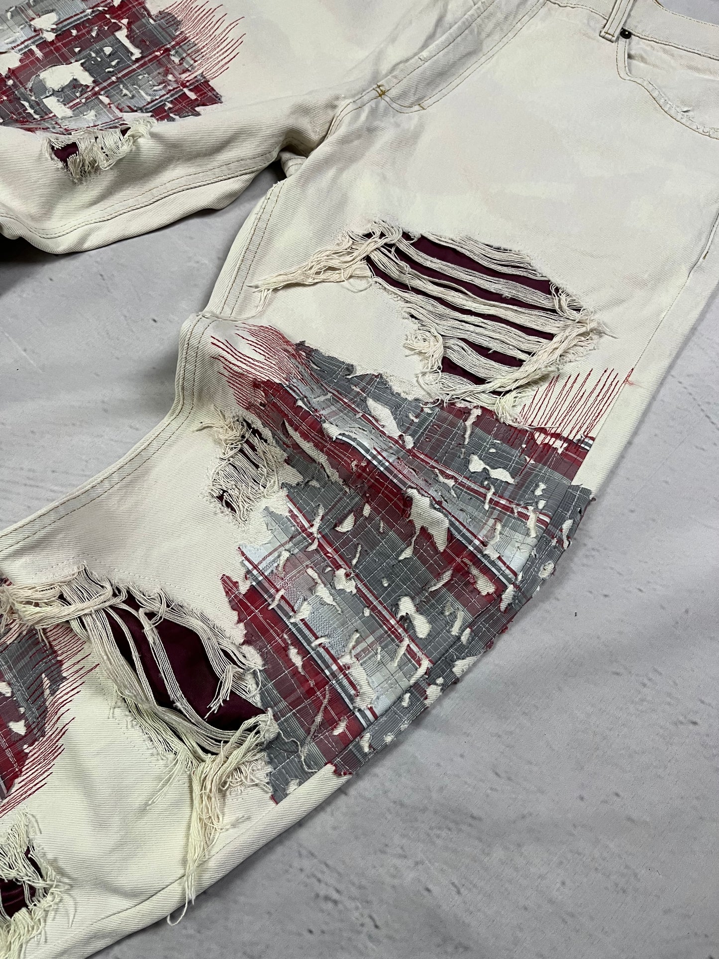 DISTRESSED PLAID PATCH DENIM