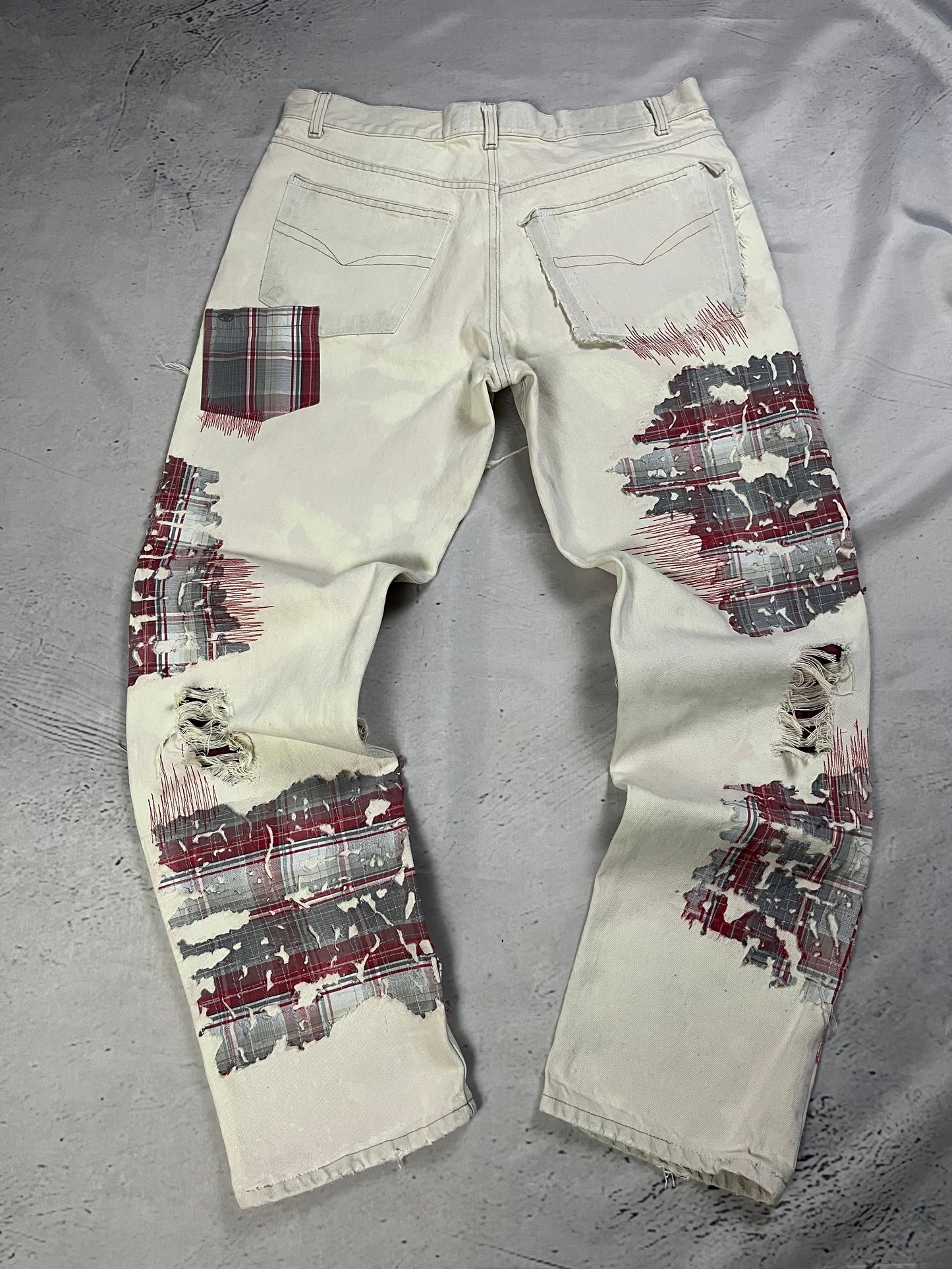 DISTRESSED PLAID PATCH DENIM