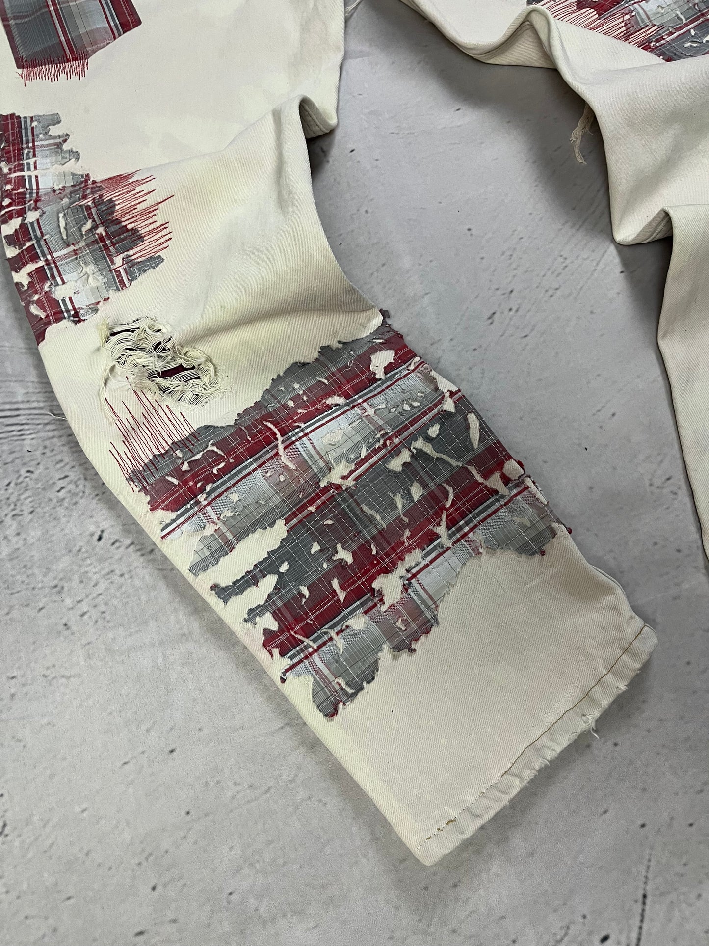 DISTRESSED PLAID PATCH DENIM