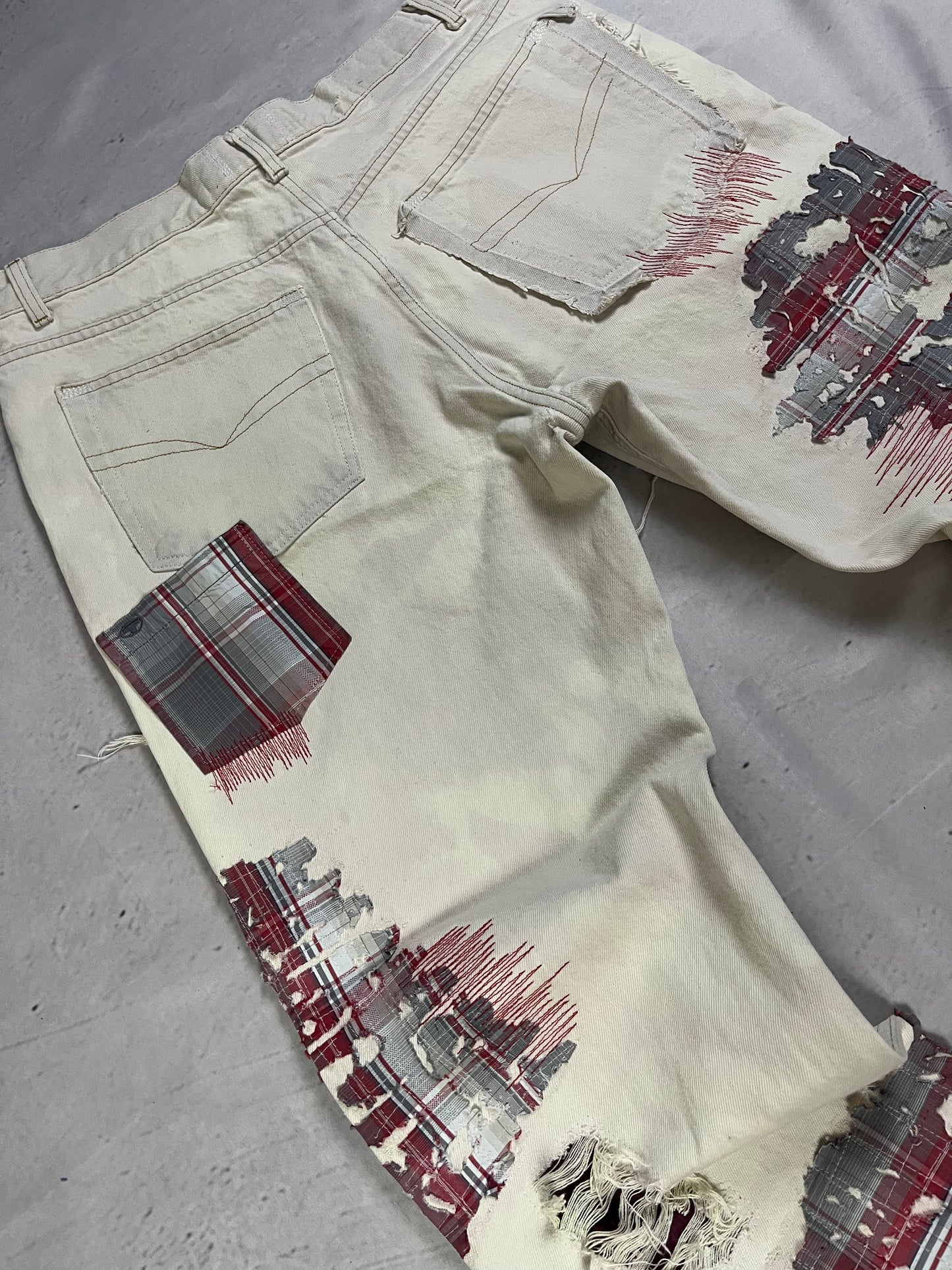DISTRESSED PLAID PATCH DENIM