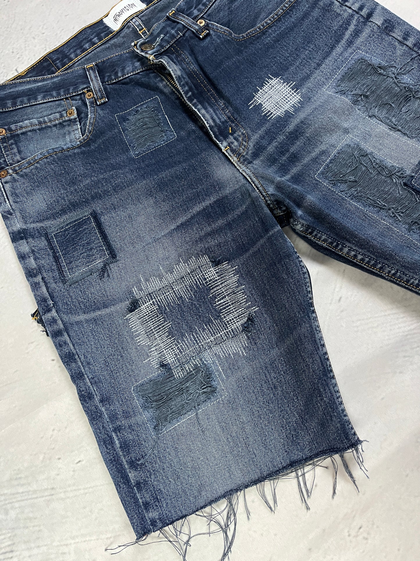 RAW STITCH DENIM SHORTS